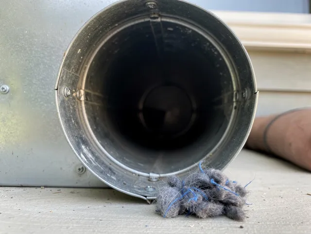 Hilton Head Island Dryer Vent Cleaning technician using specialized equipment to clear severe dryer vent blockage in Hilton Head Island